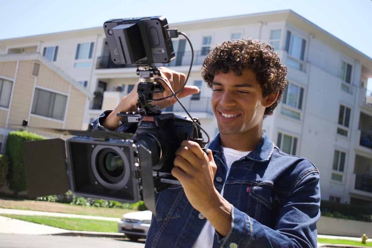 Camera operator filming on location